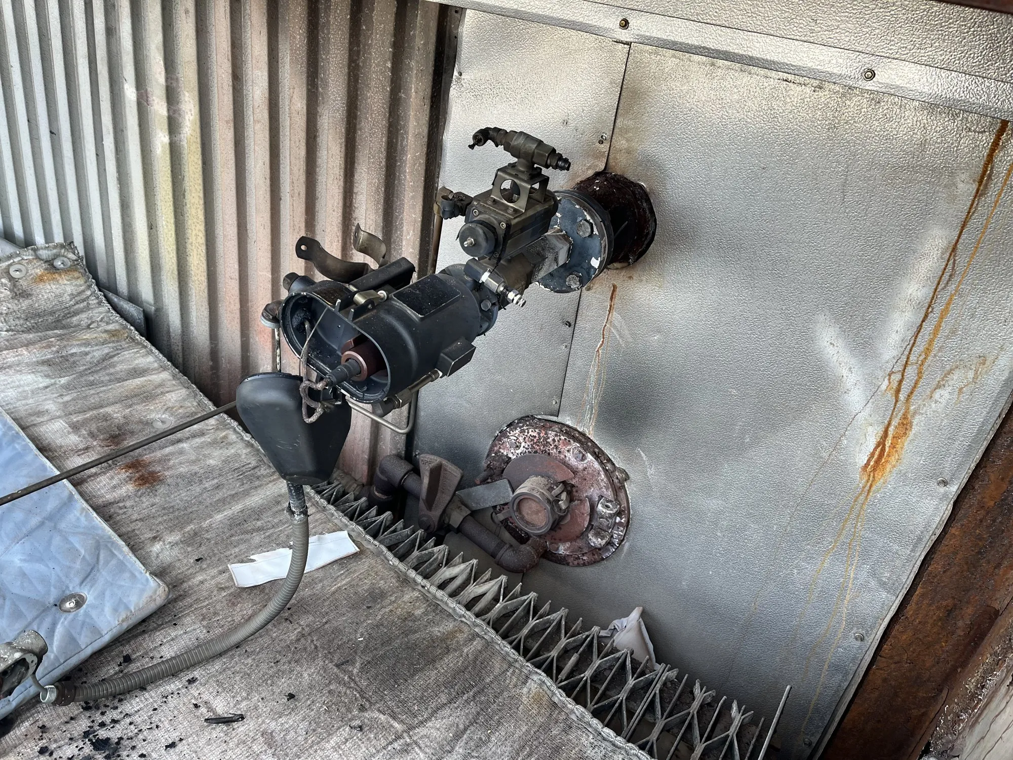 Infra-View sensor mounted on a corrugated boiler wall with its air lines connected